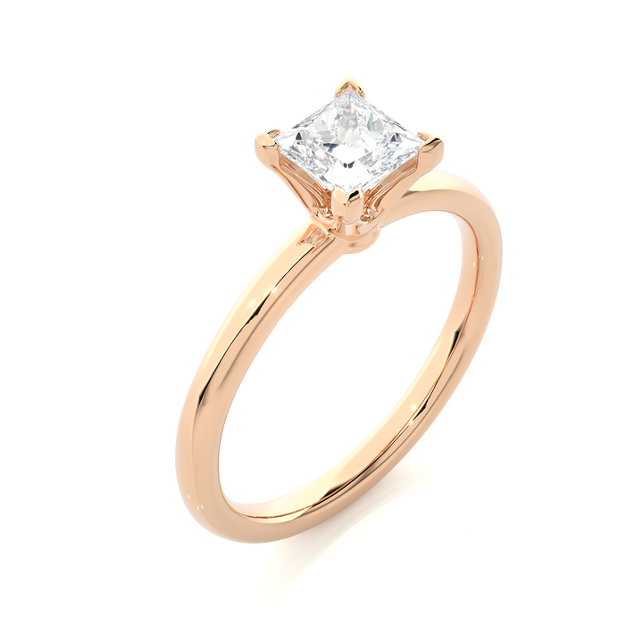 A SOLITAIRE PRINCESS  DIAMOND RING  IN PRONG SETTING