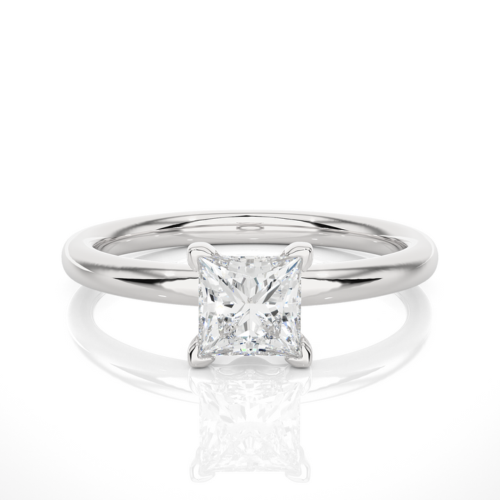 A SOLITAIRE PRINCESS  DIAMOND RING  IN PRONG SETTING