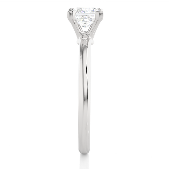 A SOLITAIRE PRINCESS  DIAMOND RING  IN PRONG SETTING