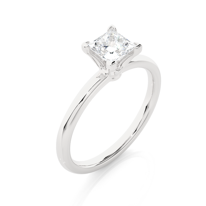 A SOLITAIRE PRINCESS  DIAMOND RING  IN PRONG SETTING