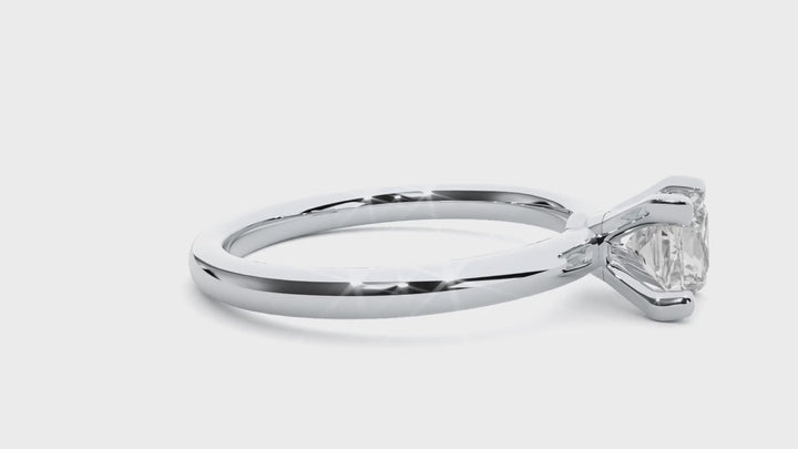 A SOLITAIRE PRINCESS  DIAMOND RING  IN PRONG SETTING