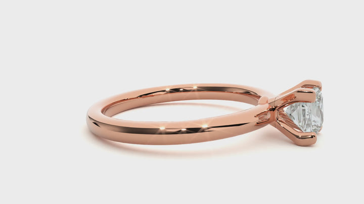 A SOLITAIRE PRINCESS  DIAMOND RING  IN PRONG SETTING